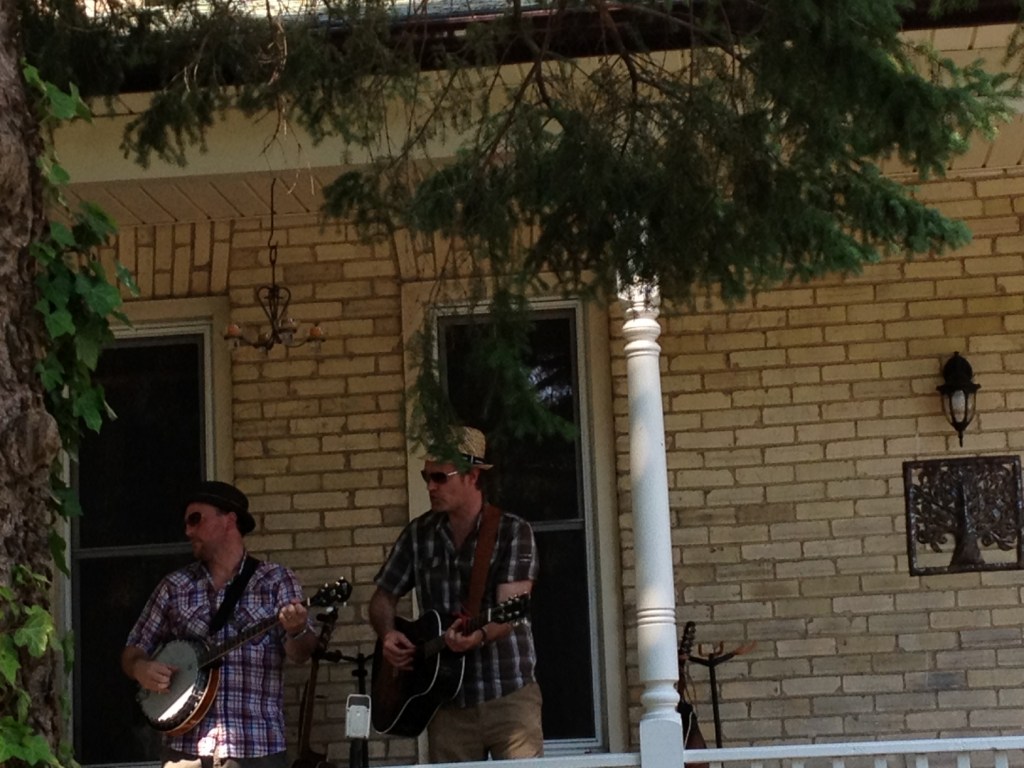Men playing music on porch