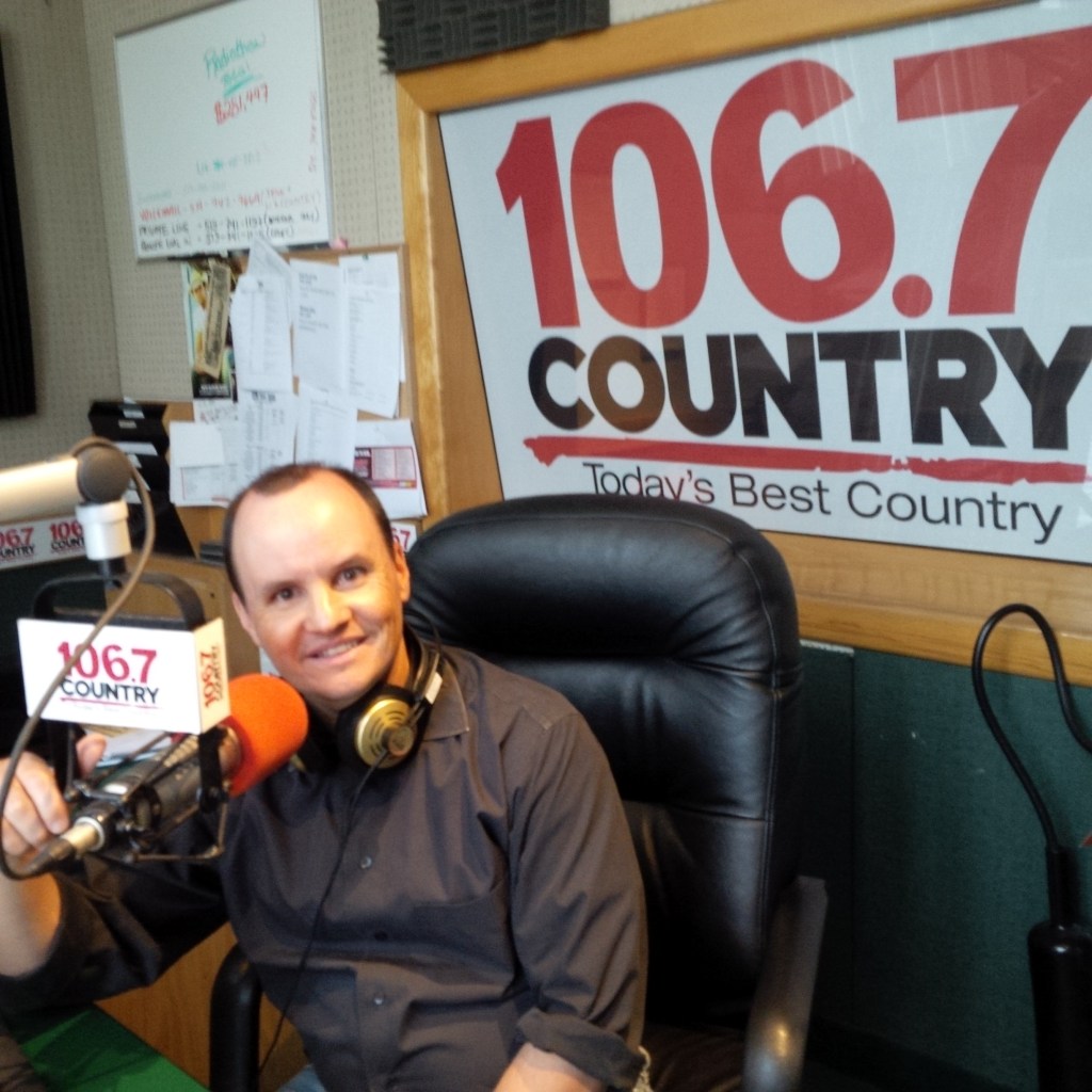 Man at microphone in radio station