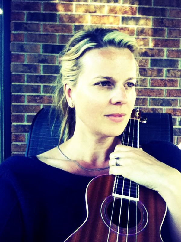 Woman holding ukelele