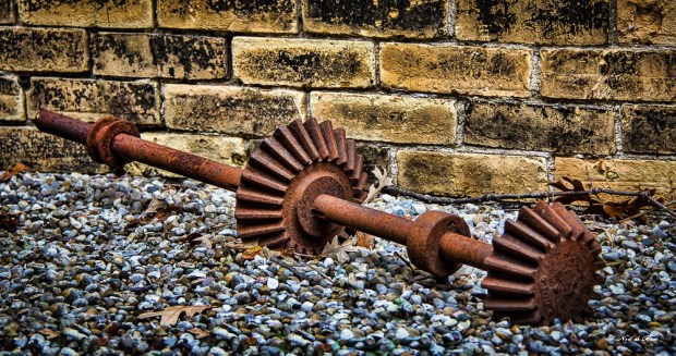 Rusted gear on gravel