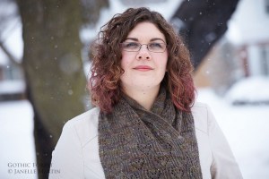 Woman with brown hair wearing scarf