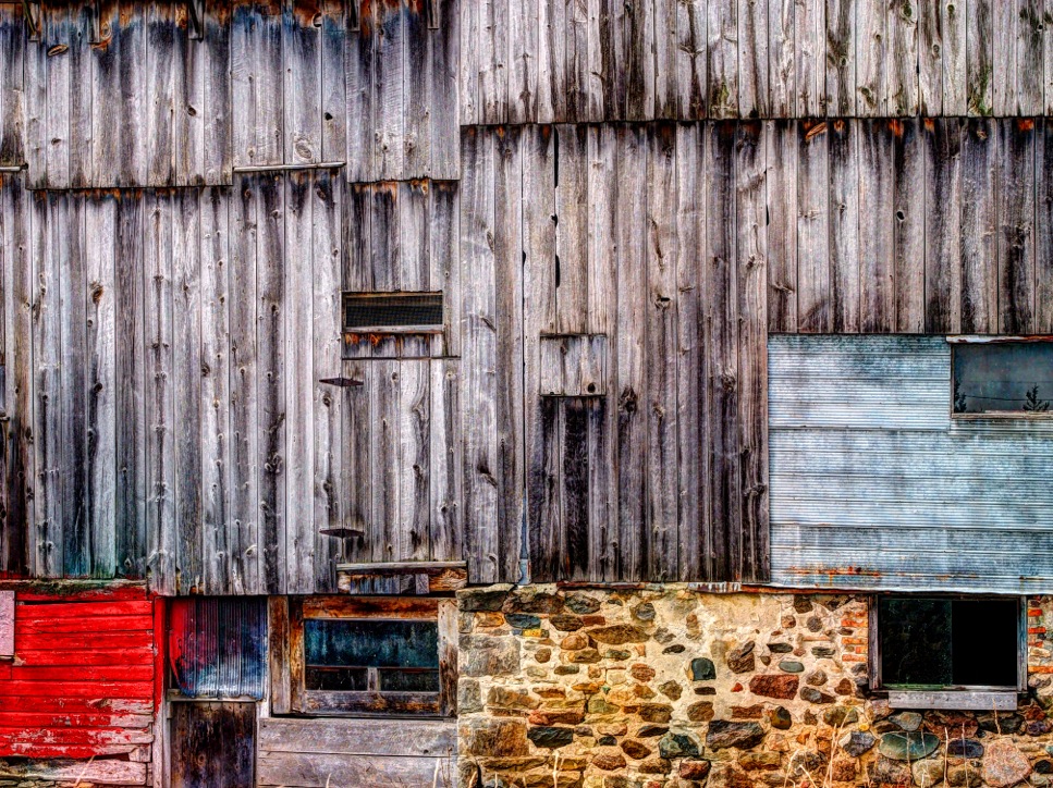 old barn with stone wall, red colour