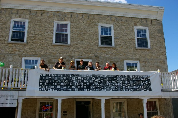 people on balcony with print