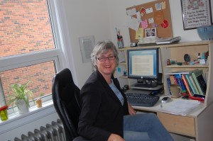 Woman at desk writing