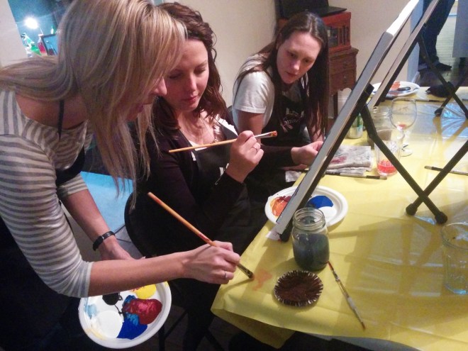 Woman teaching others how to paint