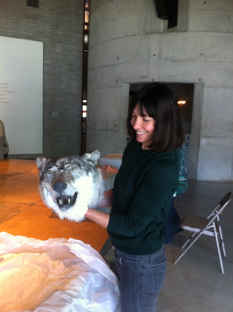 Woman holding wolf head