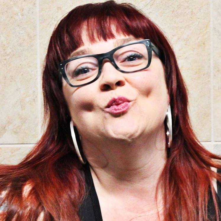 Red-headed women with lips pursed