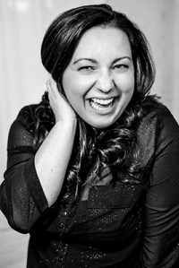 Woman laughing holding her hair